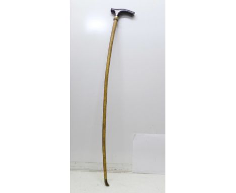 A 19th Century walking stick, L-shaped horn handle, gilt metal ferrule and horn tip, 92cm