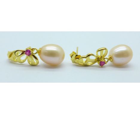 A pair of silver gilt freshwater pearl and simulated ruby drop earrings 