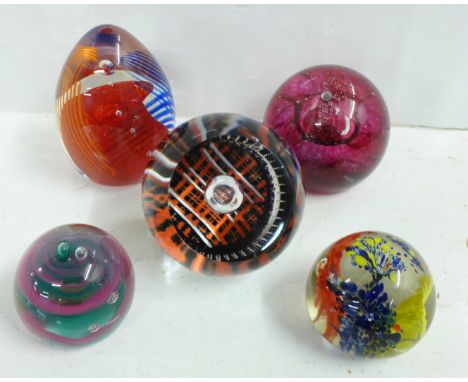 Five glass paperweights including Caithness 