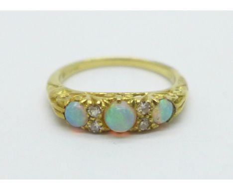 An 18ct gold, opal and diamond ring, 3.3g, K 