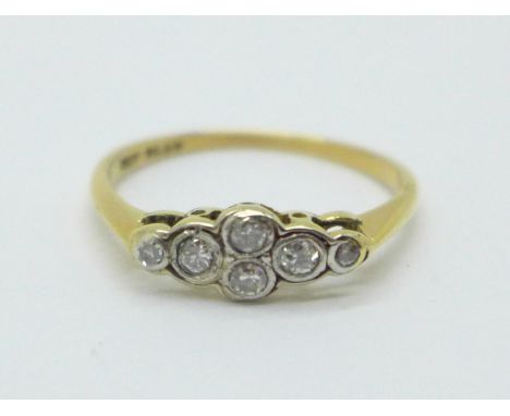 A 1930's 18ct gold and platinum seven stone diamond ring, 2g, M 