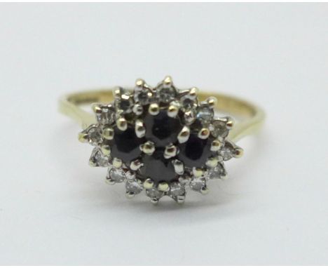 A 9ct gold, sapphire and diamond cluster ring, 2.3g, P 