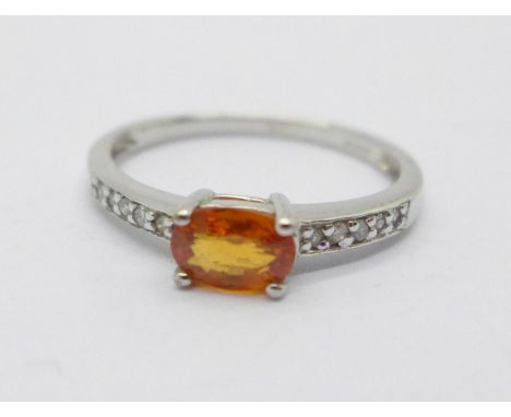 A 9ct white gold ring set with a fire opal and diamond shoulders, 1.8g, M 