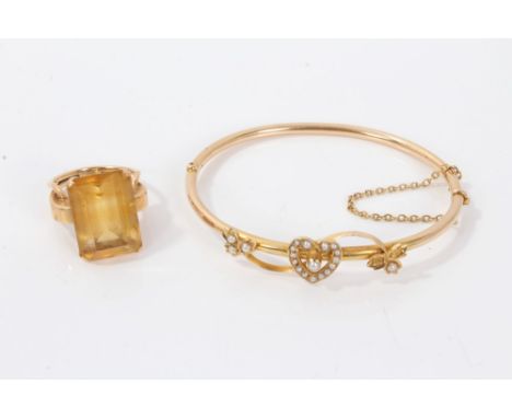 Victorian bangle with heart and leaf scroll decoration set with seed pearls, together with a rectangular step cut citrine coc