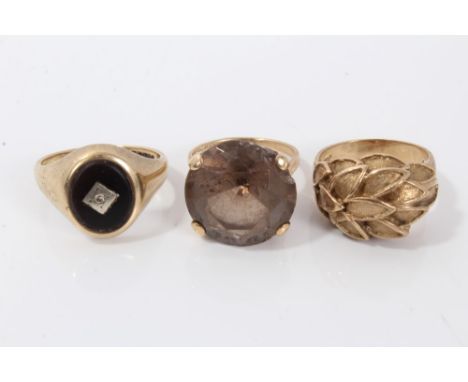 Three gold (9ct) rings to include gentlemen's black onyx ring, size S, smokey quartz cocktail ring, size N and leaf design ri