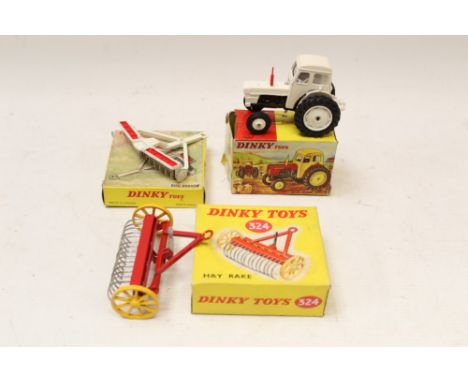 Dinky David Brown Tractor no. 305, Dm Harrow no. 332, Hay Rake no. 324, all boxed (3)