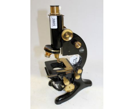 Beck London monocular microscope, black enamel stand, engraved – K.C.H. MED, SCH, with triple turret and three objectives and