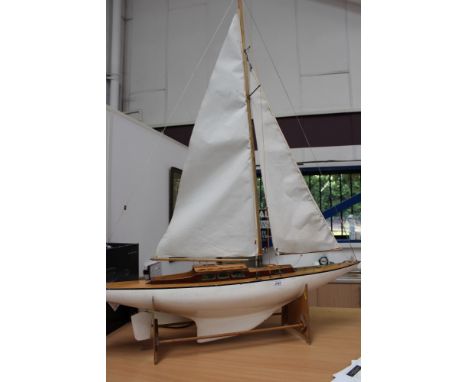 Scratch-built model of a racing yacht with wooden stand