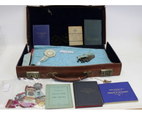 Two cases containing a collection of Masonic jewels and other regalia – including four silver gilt / enamel badges and one ot