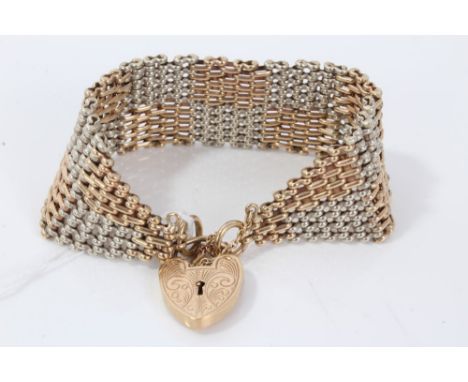 Two colour gold (9ct) gate bracelet with engraved padlock clasp and safety chain