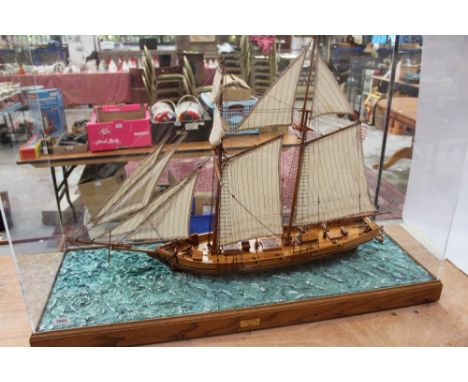 Large scratch-built model of an armed schooner, Harvey 1847, under full sale, in a perspex case, 107cm overall length