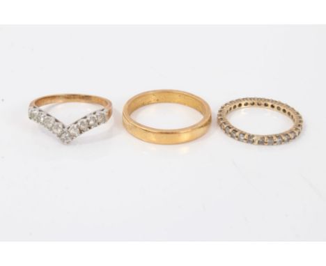 Yellow metal wedding band, size T, diamond full band eternity ring, size N and a white stone wishbone ring, size P½