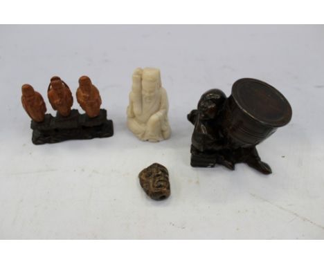 Japanese carved soapstone netsuke of mask form, together with carved soapstone deity figure, Japanese bronzed figure, carved 