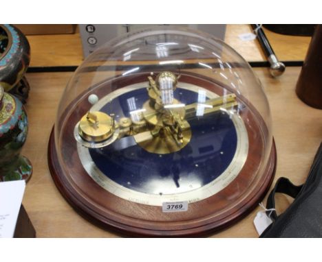 Brass orrery mounted on enamelled base with silvered scale, on mahogany base with perspex domed cover, approximately 45cm dia