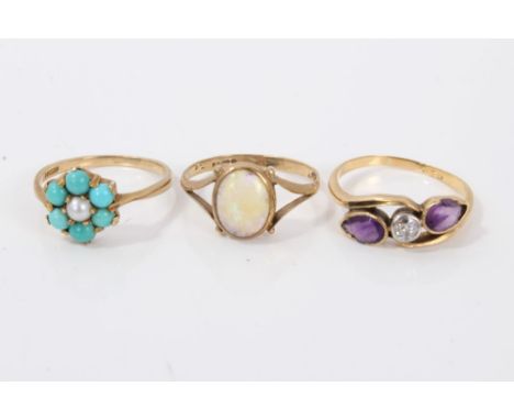 Three gold dress rings to include turquoise and seed pearl flower head cluster ring, polished opal ring and an amathsyt cross