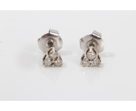 Pair white gold (18ct) diamond earrings, each with three brilliant cut diamonds forming a triangular shape, in claw setting w
