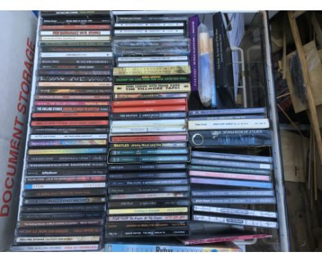 A collection of CDs by The Beatles, The Rolling Stones and Pink Floyd.