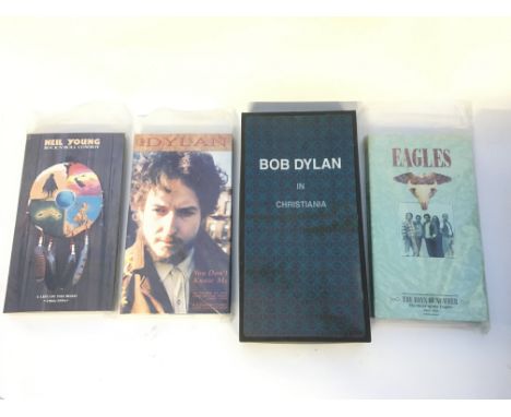 Four CD box sets by various artists including Bob Dylan, Neil Young and Eagles.