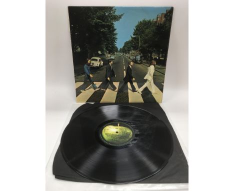 A first UK pressing of The Beatles 'Abbey Road' LP PCS 7088 with misaligned Apple logo on rear sleeve, no credits for 'Her Ma