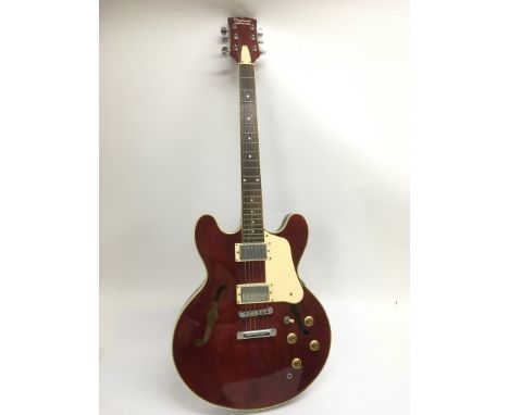 A Tanglewood Memphis electric guitar with double cutaways in a dark red finish.