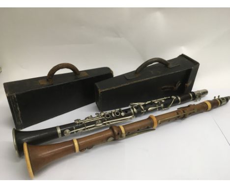 A cased 19th Century boxwood clarinet by and stamped Christopher Gerock, London, ivory mounts, brass keys, ebony mouthpiece, 