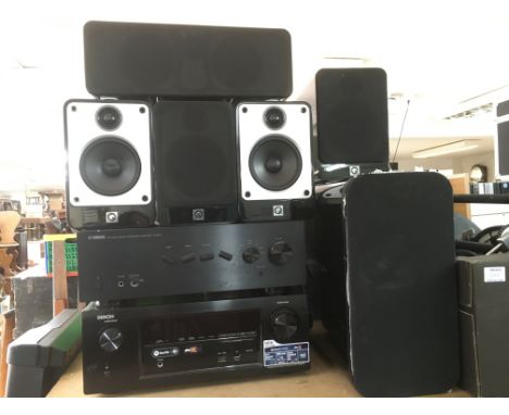 A surround sound system comprising a Denon AVR-X2200W receiver with Dolby atmos, Q subwoofer and other speakers plus a Yamaha