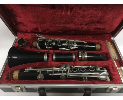 A cased Regent clarinet.