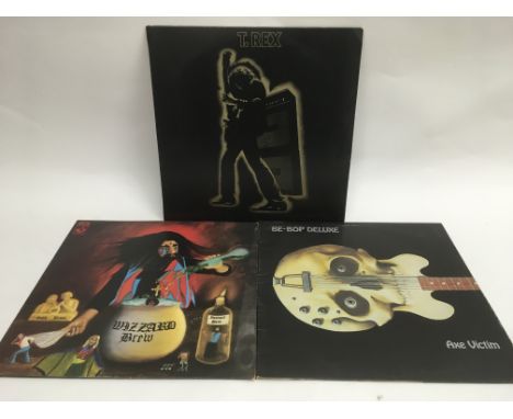Three glam rock LPs comprising T Rex 'Electric Warrior' (no poster), Wizzard 'Wizzard Brew' and Be Bop Deluxe 'Axe Victim'.