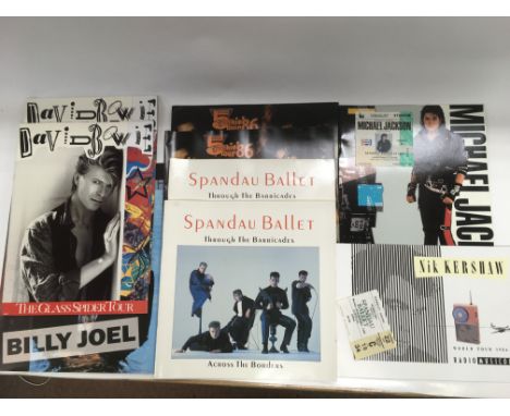 A collection of various tour brochures and tickets. Various artists including Michael Jackson, David Bowie, Spandau Ballet an