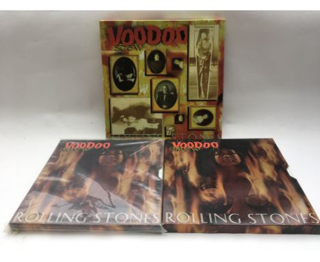 Three Rolling Stones 12x12 CD box sets.