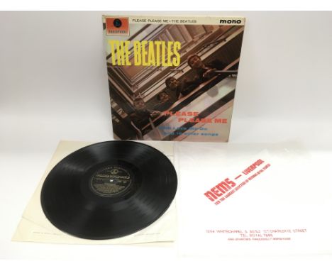 A first UK mono pressing of The Beatles 'Please Please Me' LP with black and gold Parlophone labels and Dick James Music cred