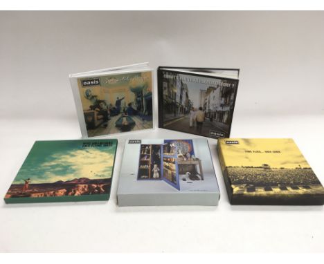 Four Oasis CD box sets plus a deluxe CD of Noel Gallagher's Flying Birds 'Who Built The Moon?' (5).
