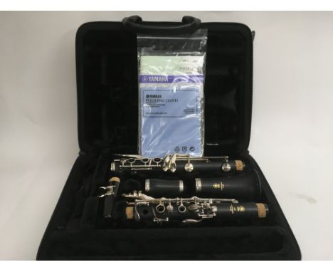 A cased and as new Yamaha clarinet with accessories.