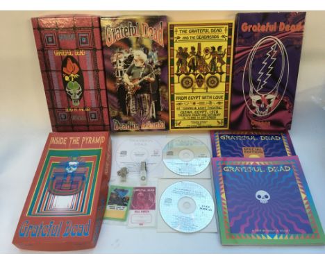 A Grateful Dead collection of CD box sets, 'A Trip Without A Ticket' books and two tour laminates.