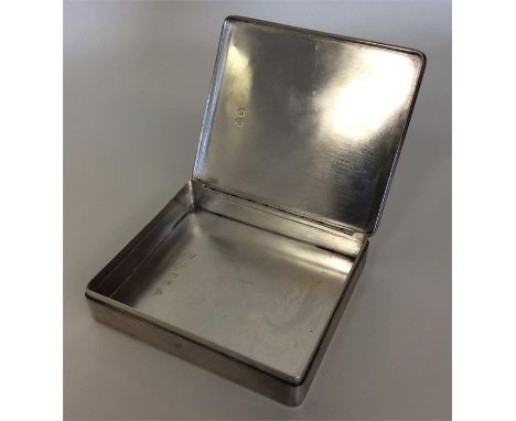 A good quality rectangular engine turned box with hinged silver cover. London. By Garrards. Approx. 134 grams. Est. £80 - £12