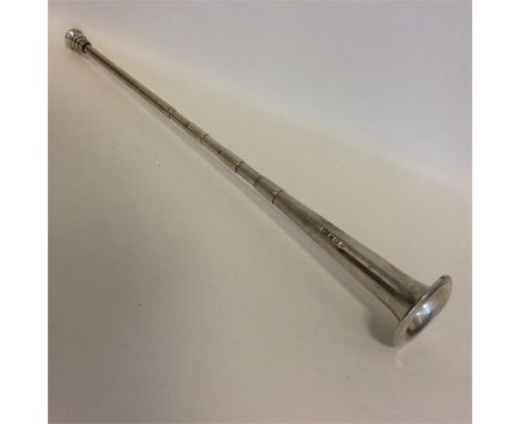 A large silver hunting horn of tapering form. Approx. 30 cms long. Birmingham. By EB. Est. £50 - £80.