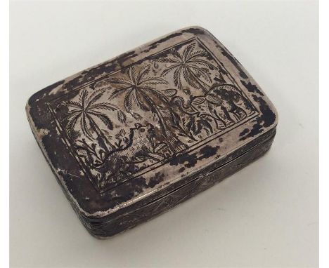 An Indian silver hinged top snuff box decorated with palm trees. Approx. 46 grams. Est. £25 - £35.