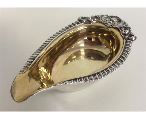 PAUL STORR: A rare pap boat with silver gadroon rim mounted with flowers and leaves and gilt interior. Approx. 83 grams. Est.