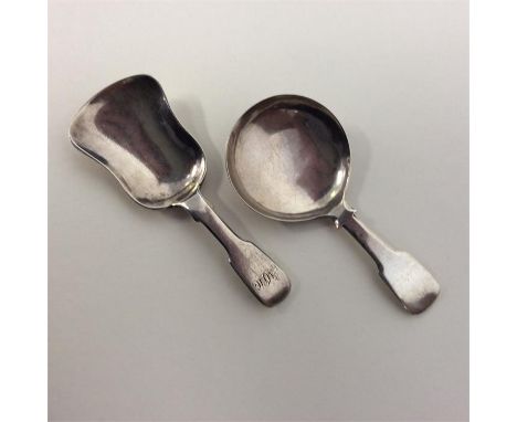A heavy Georgian fiddle pattern caddy scoop with silver wavy edge together with one other. Approx. 26 grams. Est. £30 - £40.