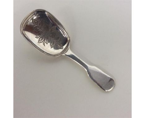 An attractive Victorian silver caddy spoon, the bowl decorated with flowers and leaves. London. By TS. Approx. 12 grams. Est.