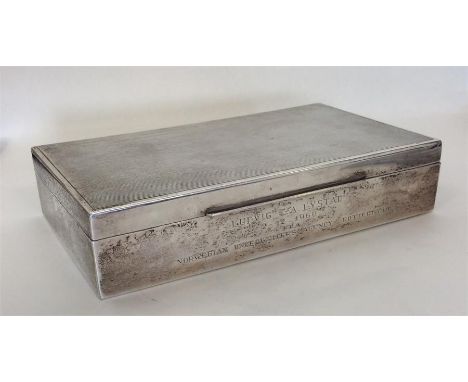 A good large rectangular silver cigarette box with engine turned decoration. Marked Sterling. Approx. 405 grams. Est. £50 - £