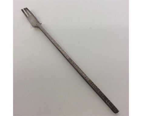 A stylish silver pickle fork with textured handle. London. By AW. Approx. 20 grams. Est. £20 - £30.