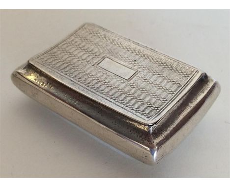 A rectangular Georgian silver snuff box with hinged top and gilt interior. Birmingham. By TF. Approx. 22 grams. Est. £100 - £