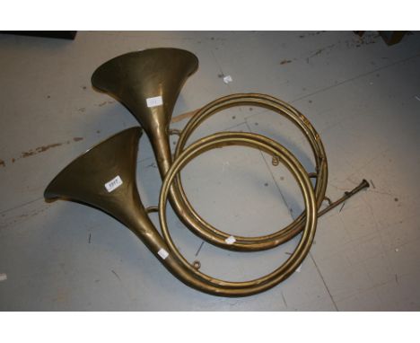 Pair of French brass hunting horns inscribed Uytter, Paris