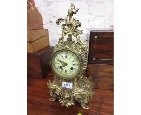 19th Century French ormolu mantel clock, the ceramic dial with Arabic and Roman numerals with a two train movement striking o