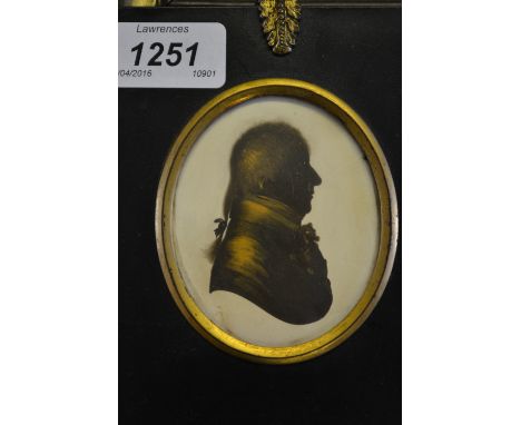 19th Century gilt heightened portrait silhouette miniature of a gentleman in profile in an ebonised and gilt mounted frame