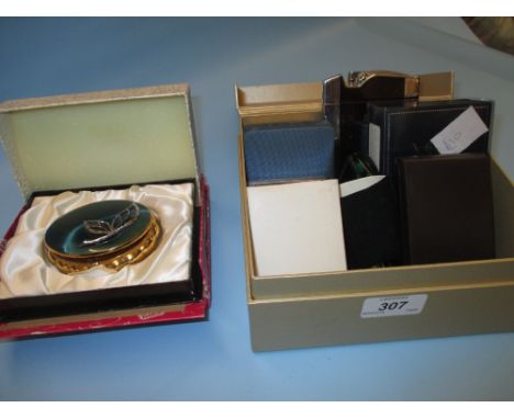 Quantity of cigarette lighters together with a boxed Kigu musical compact