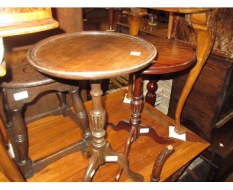 Two 20th Century mahogany wine tables on tripod bases together with a square oak occasional table on turned supports