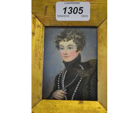 Gilt framed miniature portrait painting of a young man in black tunic and pearls