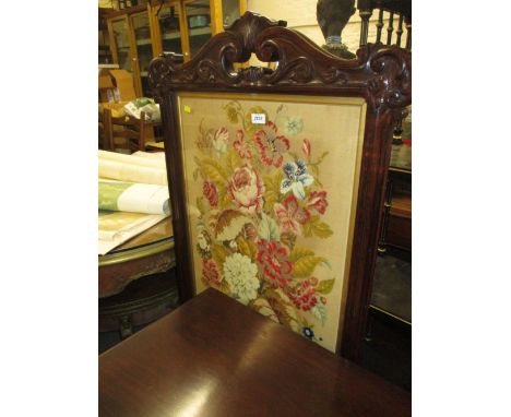 William IV rosewood woolwork inset firescreen with a scroll top raised on splay supports